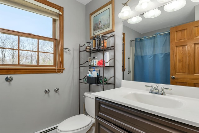 bathroom with vanity, a shower with shower curtain, baseboard heating, and toilet