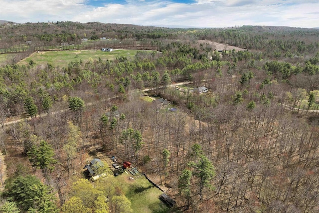 birds eye view of property with a wooded view