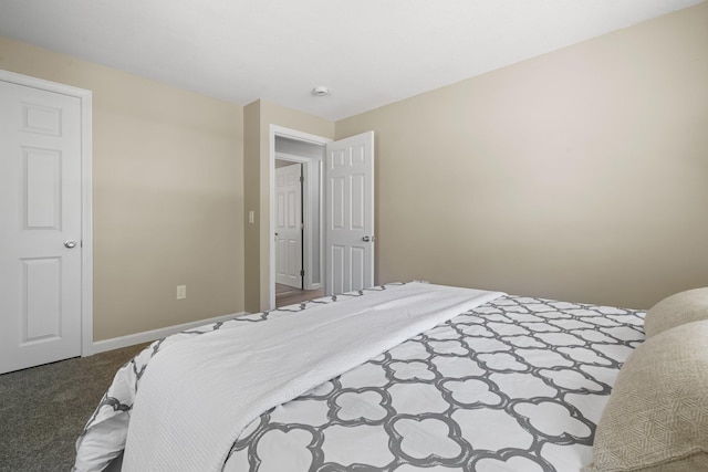 carpeted bedroom with baseboards