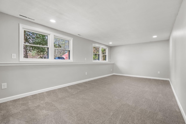 unfurnished room featuring baseboards, carpet, recessed lighting, and visible vents