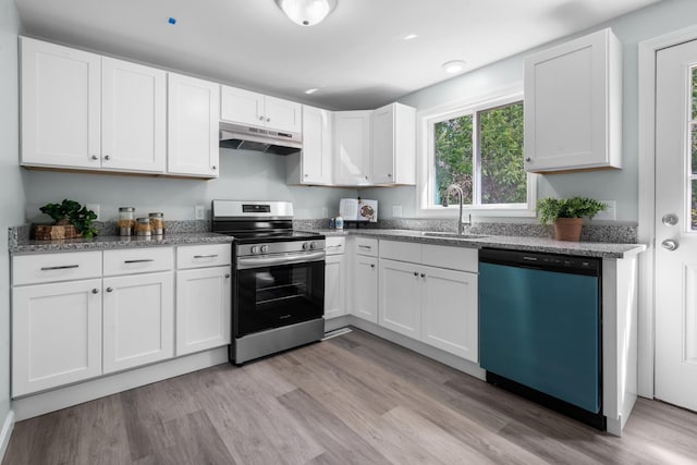 kitchen featuring dishwasher, a sink, electric stove, under cabinet range hood, and white cabinetry