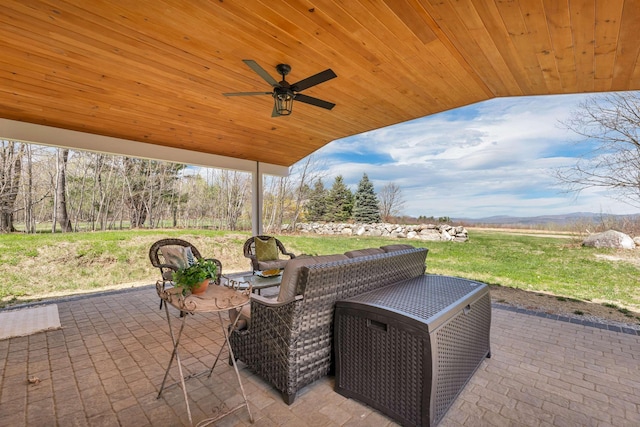 view of patio featuring ceiling fan