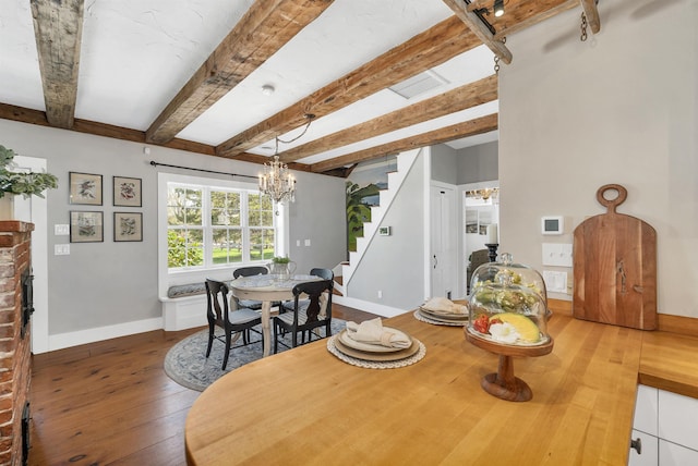 dining space with an inviting chandelier, baseboards, stairway, and hardwood / wood-style floors