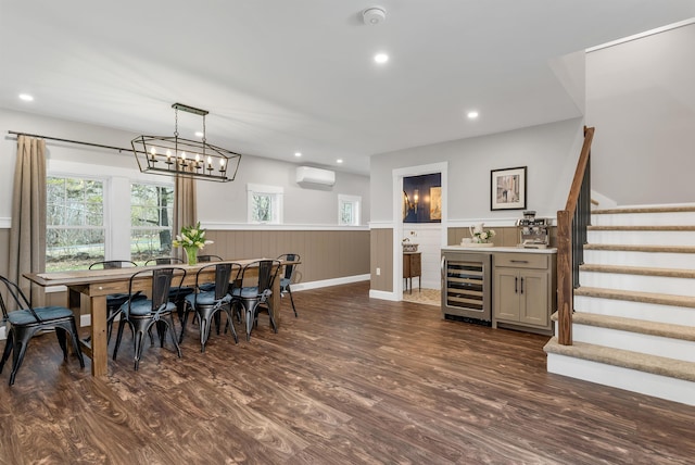 dining room with dark wood finished floors, stairway, a wainscoted wall, an AC wall unit, and wine cooler