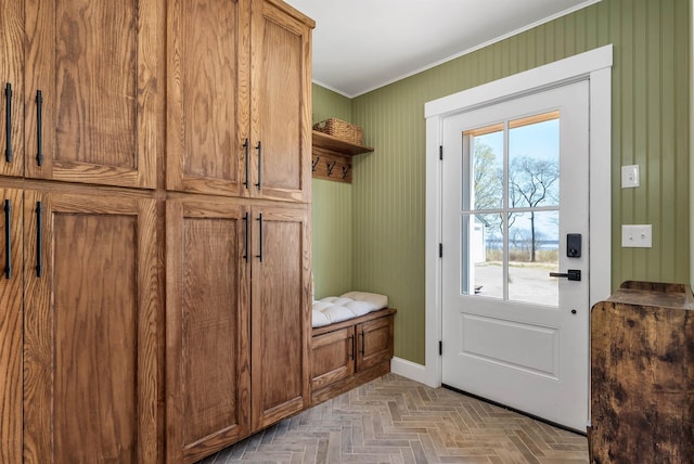 mudroom featuring baseboards and ornamental molding