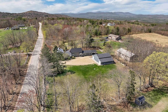 bird's eye view featuring a view of trees and a mountain view