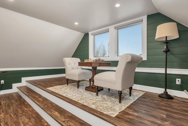sitting room with baseboards, wood finished floors, and lofted ceiling