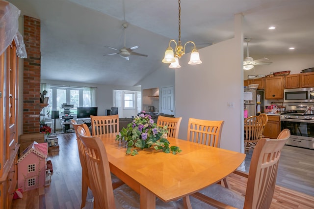 dining room featuring light wood-style flooring, ceiling fan, and vaulted ceiling