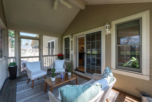 exterior space featuring ceiling fan and beamed ceiling