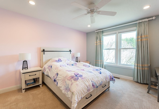 bedroom with baseboards, light carpet, and recessed lighting