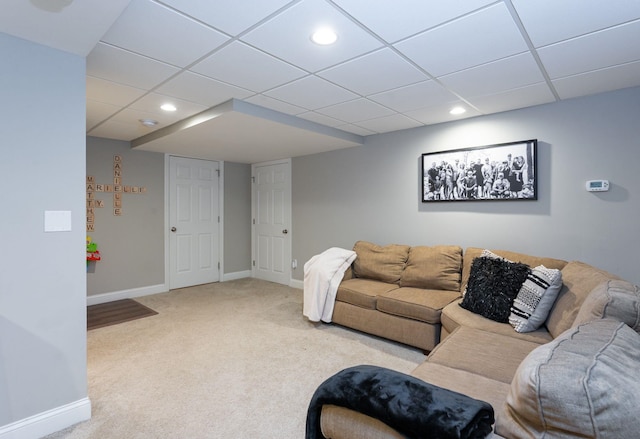 living area featuring baseboards, recessed lighting, a drop ceiling, and carpet flooring
