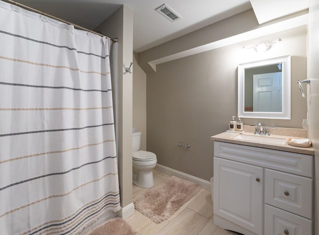full bathroom with visible vents, tile patterned floors, baseboards, vanity, and toilet