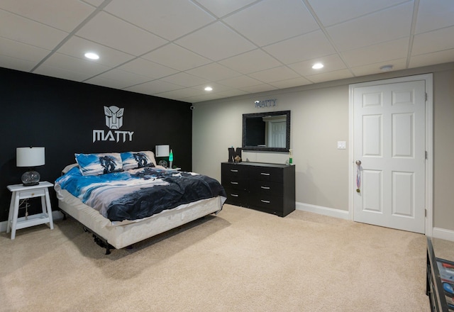 bedroom featuring light colored carpet, recessed lighting, and a paneled ceiling