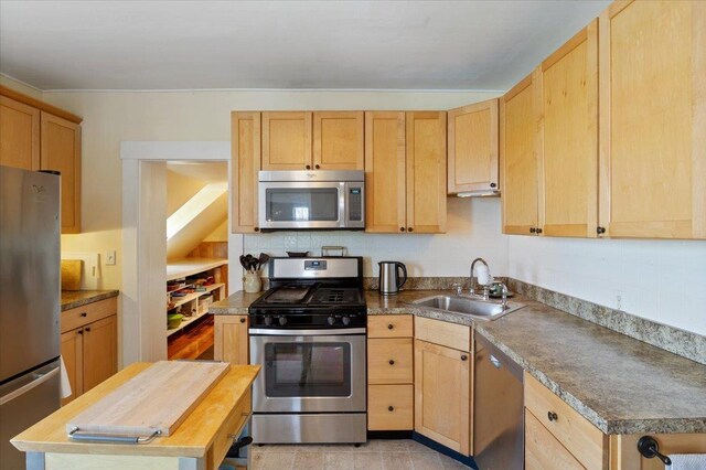16 Manchester St Unit 2, Pittsfield, NH 03263 - kitchen with a sink, light brown cabinetry, stainless steel appliances, and butcher block counters