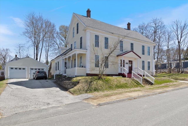 16 Manchester St Unit 2, Pittsfield, NH 03263 - colonial inspired home featuring a detached garage, an outbuilding, and a chimney