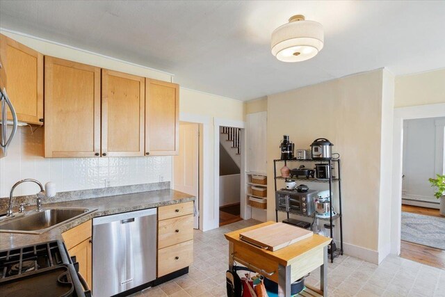 16 Manchester St Unit 2, Pittsfield, NH 03263 - kitchen featuring a sink, dishwasher, gas range, decorative backsplash, and light floors