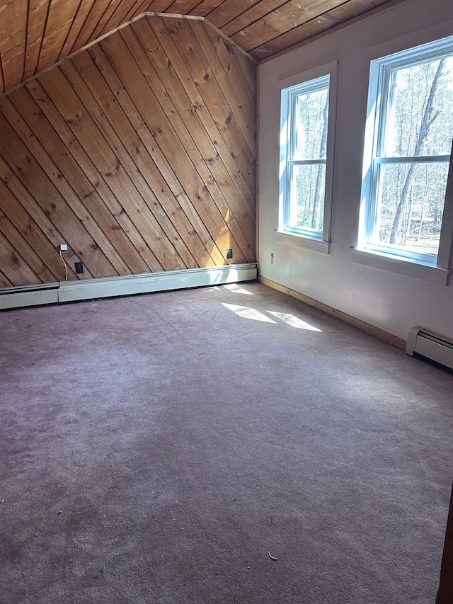 unfurnished room with carpet floors, wood walls, lofted ceiling, baseboards, and wood ceiling