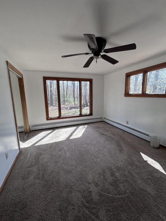 unfurnished room with ceiling fan, baseboard heating, and carpet flooring