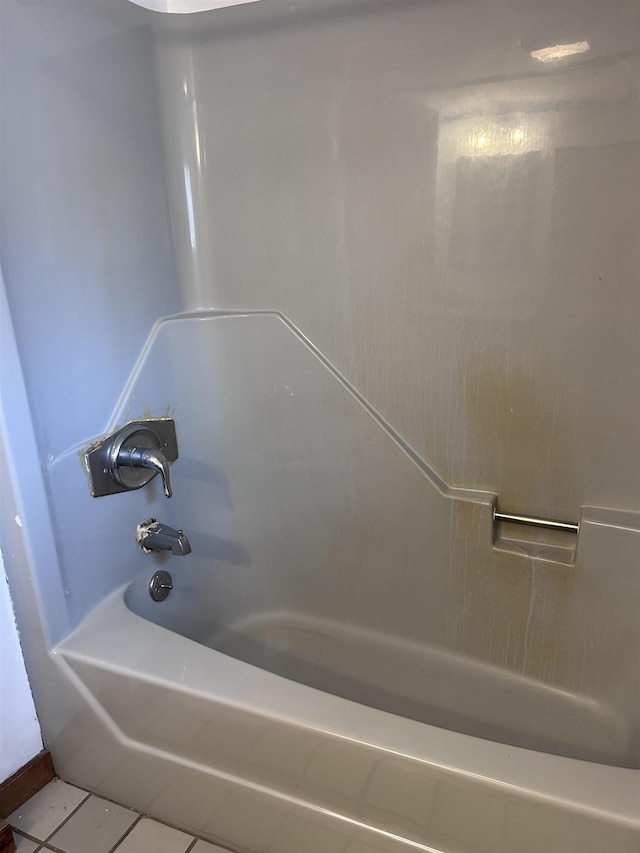 full bath with tile patterned floors and tub / shower combination