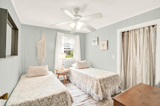 bedroom featuring crown molding and a ceiling fan