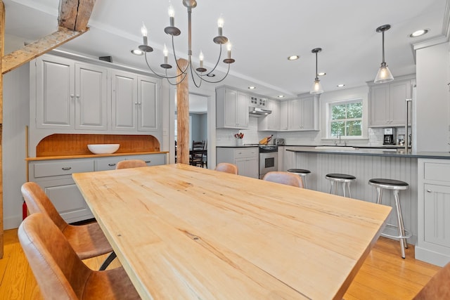 dining room featuring light wood-style floors and recessed lighting