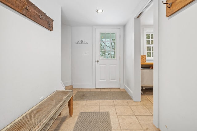 interior space featuring baseboards and recessed lighting