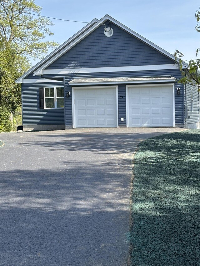 74 Lakeshore Dr, Ashburnham, MA 01430 - view of front of home featuring driveway and an attached garage