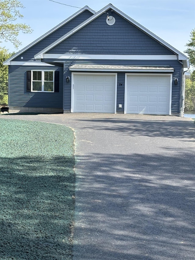 74 Lakeshore Dr, Ashburnham, MA 01430 - view of front facade with asphalt driveway and an attached garage