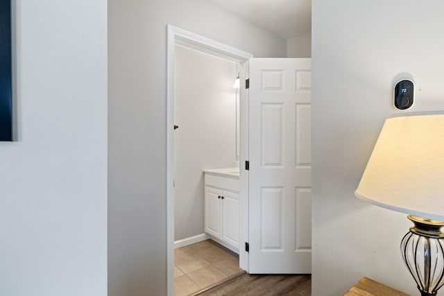 hallway with light wood-style floors