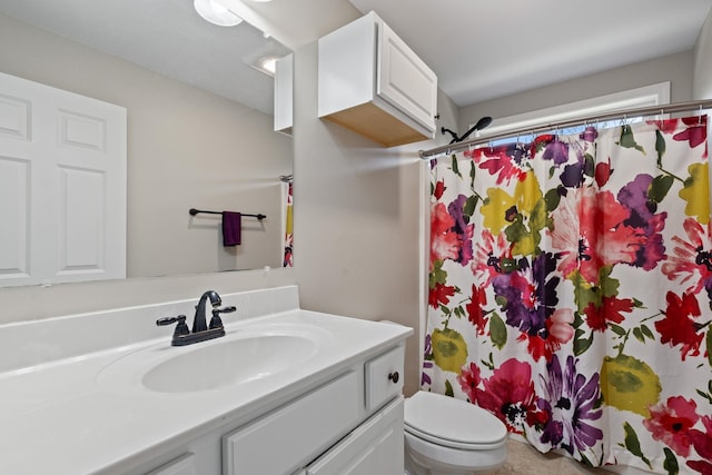 bathroom with vanity, a shower with curtain, and toilet
