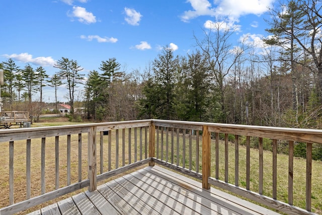 wooden terrace with a yard