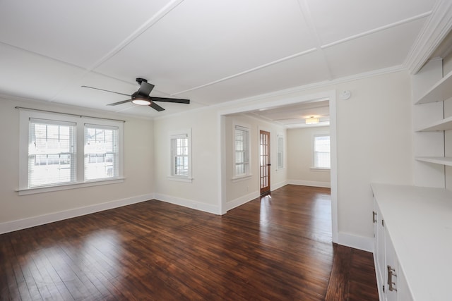 unfurnished living room with crown molding, ceiling fan, dark wood-style floors, and baseboards
