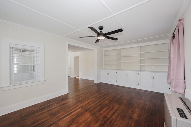 unfurnished living room featuring a ceiling fan, crown molding, dark wood finished floors, built in shelves, and baseboards