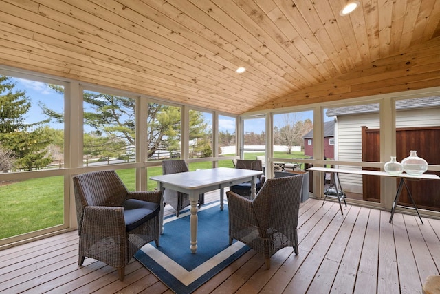 sunroom featuring outdoor dining space