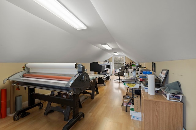 bonus room featuring light wood-type flooring and lofted ceiling
