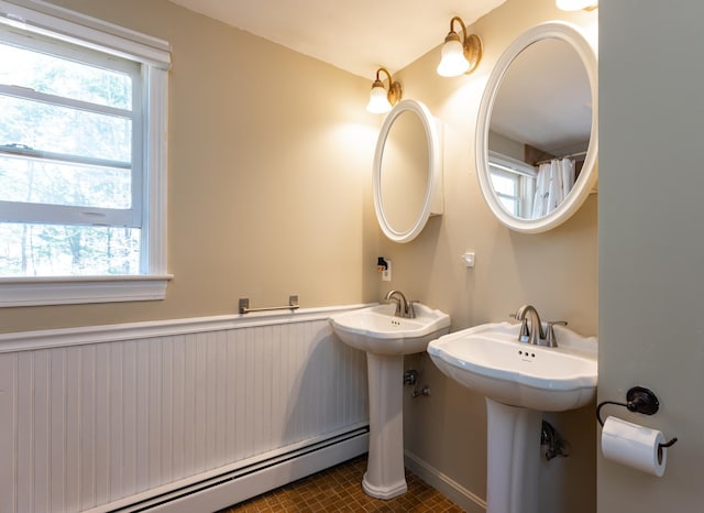 full bathroom featuring a baseboard radiator