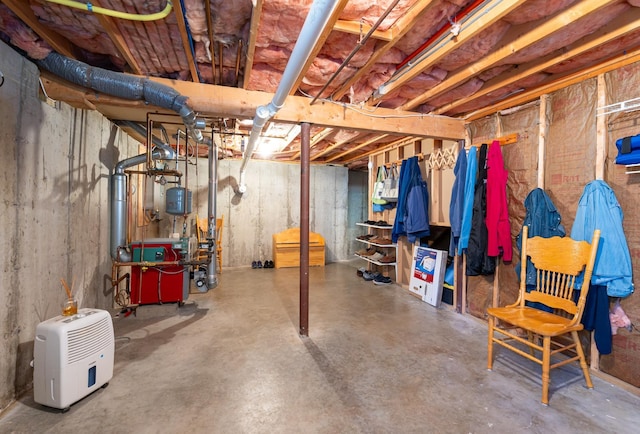 unfinished below grade area with a heating unit