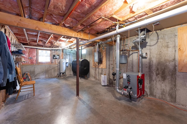 basement with a heating unit, heating fuel, and electric panel
