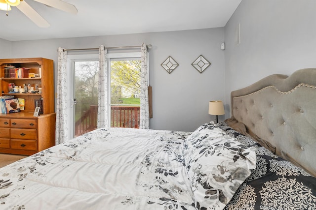 bedroom with access to outside and a ceiling fan
