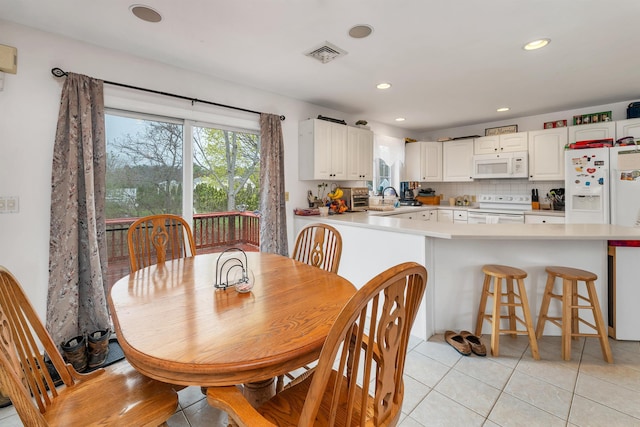 dining room featuring light tile patterned floors, recessed lighting, and visible vents