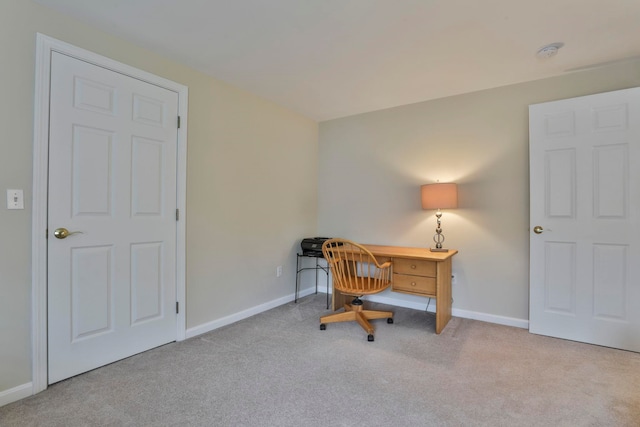 home office featuring baseboards and carpet