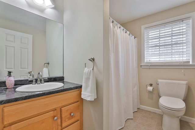 full bath with curtained shower, baseboards, tile patterned floors, vanity, and toilet