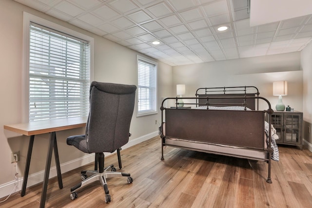 bedroom featuring recessed lighting, baseboards, and wood finished floors