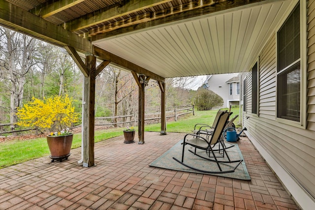 view of patio / terrace featuring fence