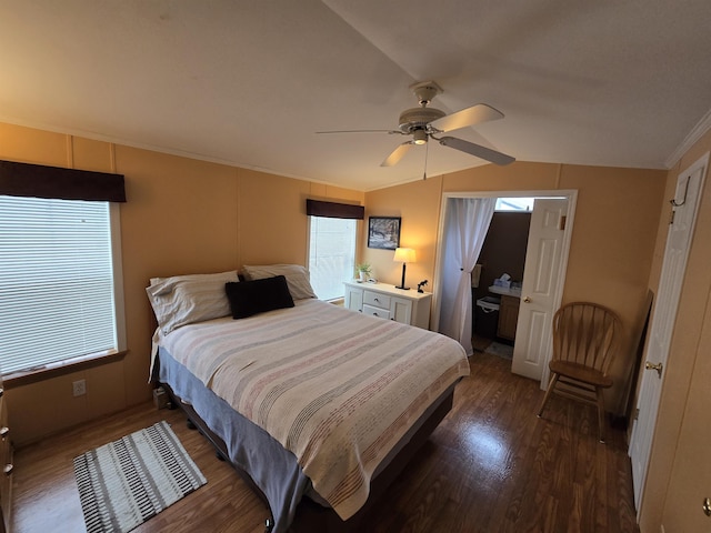 bedroom with multiple windows, dark wood-style floors, ornamental molding, and lofted ceiling