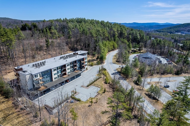 bird's eye view with a wooded view and a mountain view