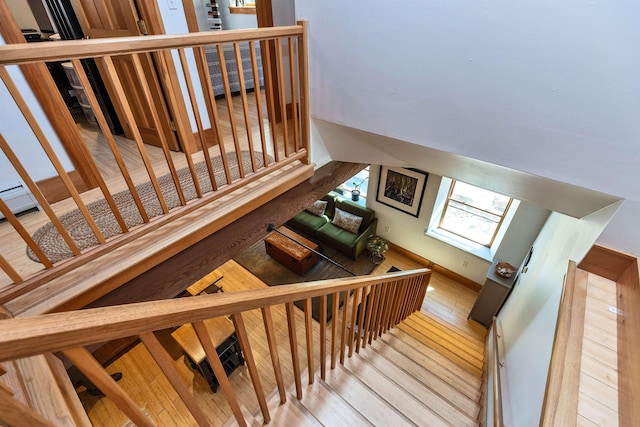 stairway featuring wood finished floors