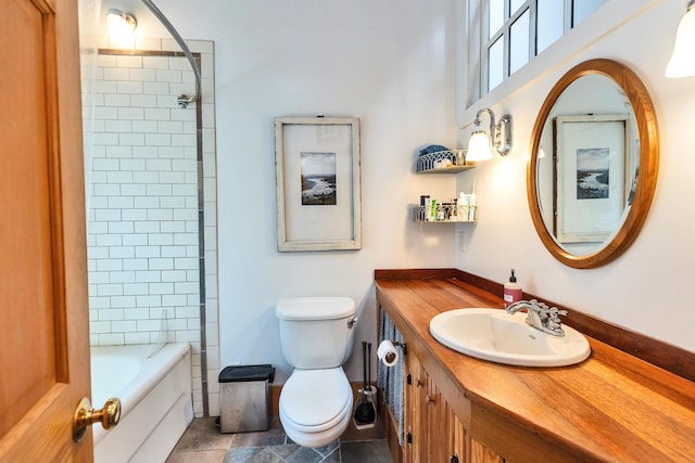 bathroom featuring vanity, tile patterned floors, and toilet