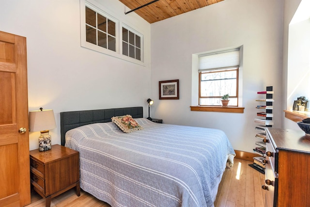 bedroom with wood-type flooring and wooden ceiling