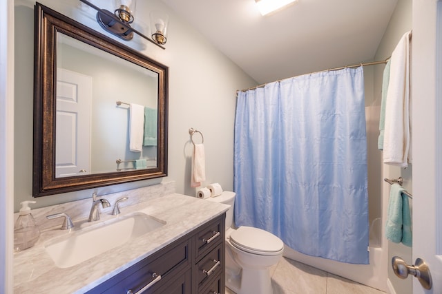 bathroom with toilet, tile patterned floors, shower / tub combo, and vanity